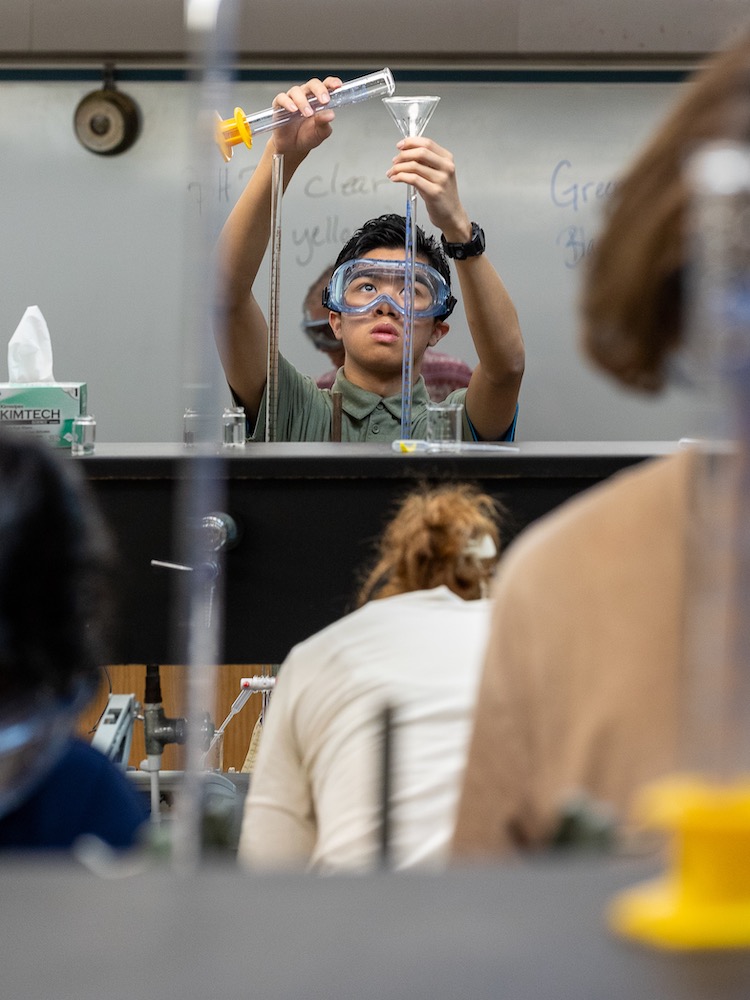 Student conducting chemistry experiment